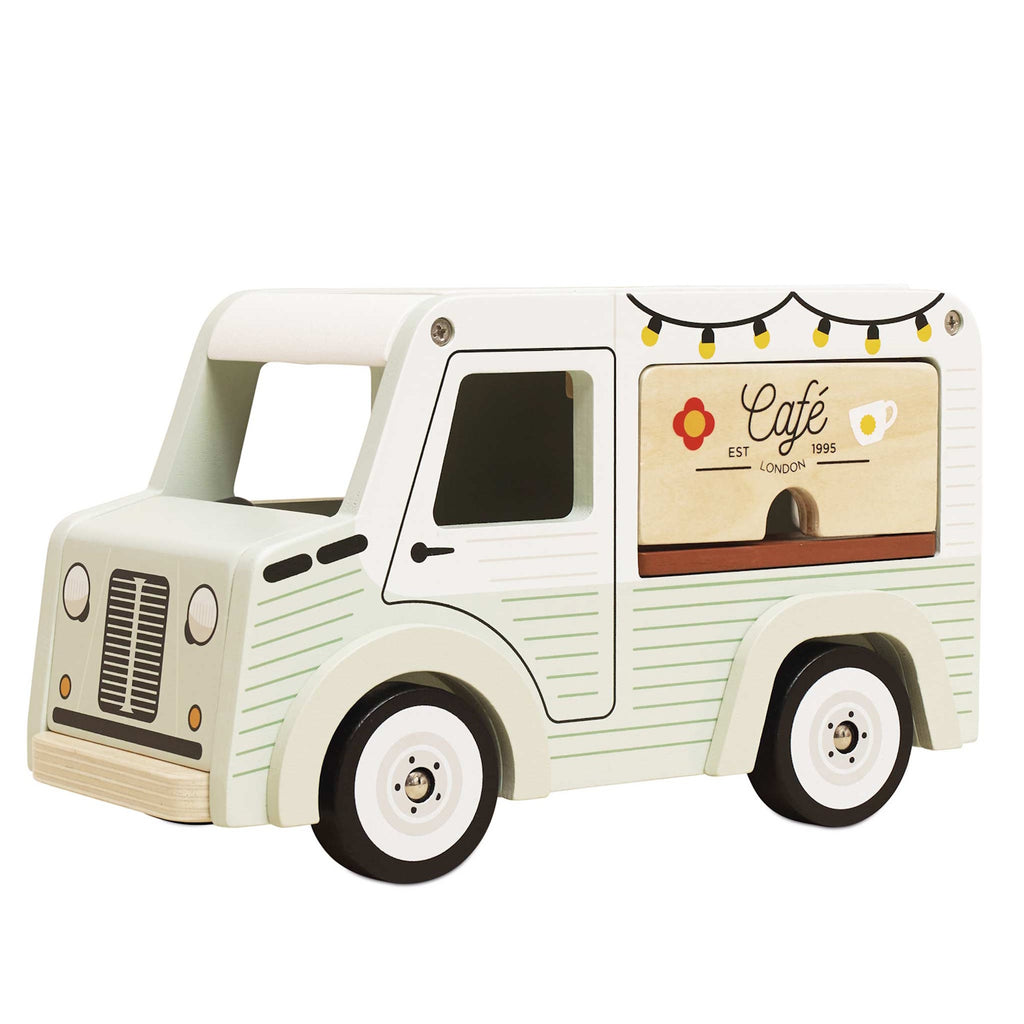 Toy van with a vintage café theme. Light green with cafe signs, decorative lights, and charming details. Whimsical and nostalgic feel.