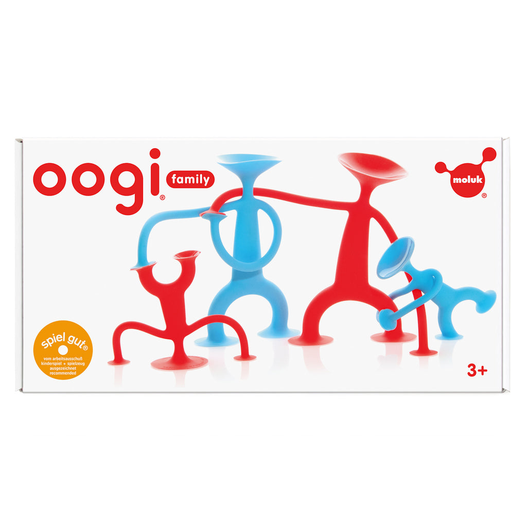 Box cover displaying colorful Oogi family toys with red and blue figures in playful poses. Labeled for ages 3 and up, with Moluk branding.