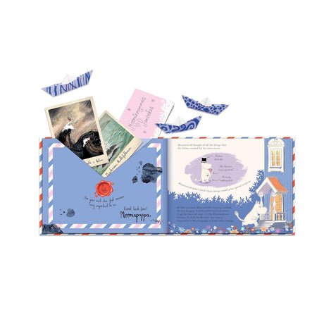 Open book titled Moomin Mail featuring an envelope with postcards, paper boats, and a letter signed by Moominpappa.