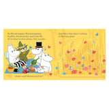 Moomin characters having a picnic in a field with tall grass, from the book "Where Are You, Moomintroll?"