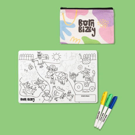 Born Bizzy farmyard coloring mat set with a patterned zippered pouch and three colored markers on a green background.