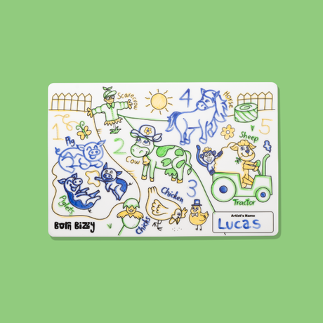 Colorful farm-themed coloring mat featuring animals, a tractor, numbers, and the hand-written name "Lucas".