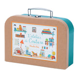 Moulin Roty L'Atelier de Couture kids sewing kit teal kraft suitcase with illustrated sewing room design.