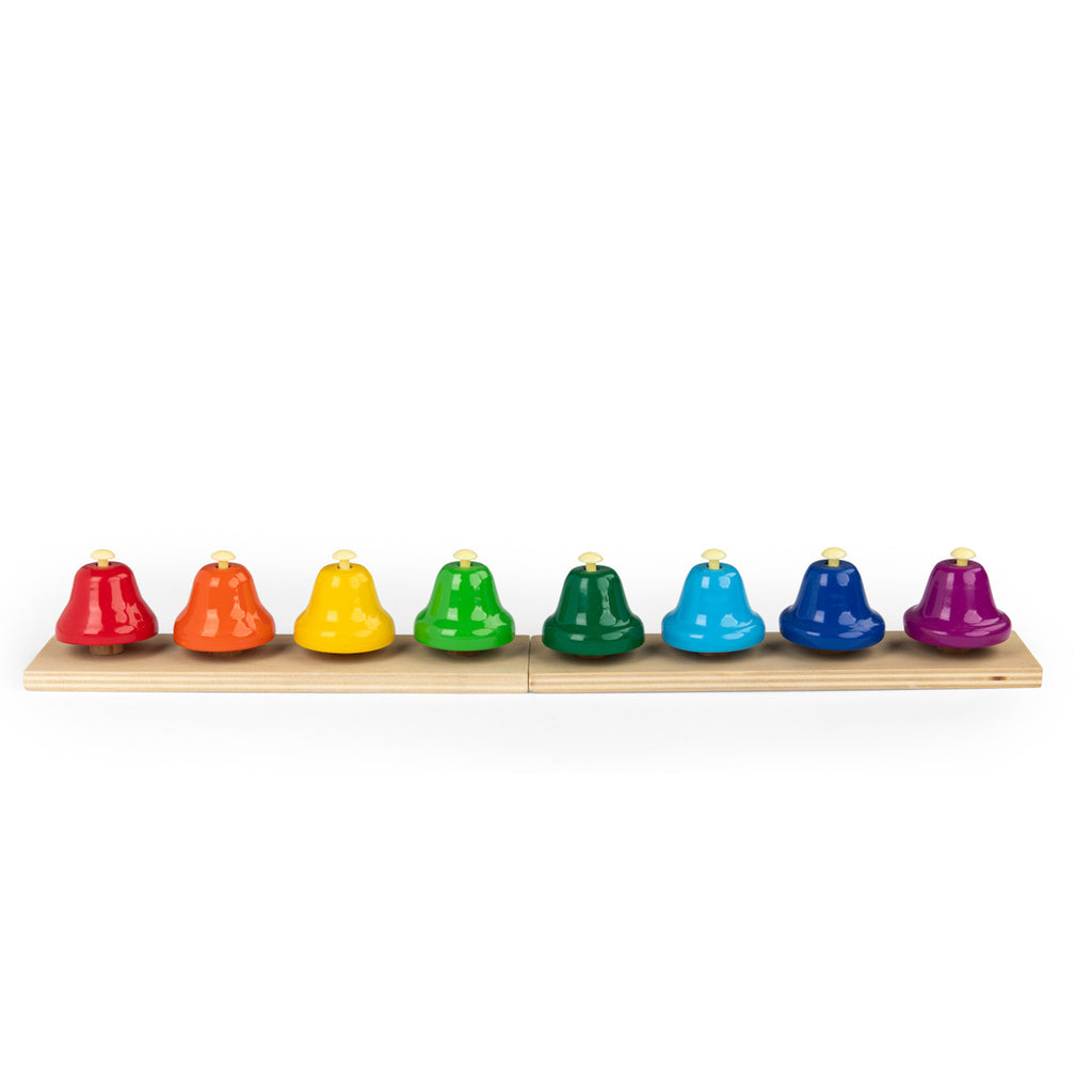 A row of eight colorful handbells on a wooden base, arranged in red, orange, yellow, light green, dark green, light blue, dark blue, and purple from left to right.
