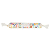 Packaged set of six colorful crepe paper surprise balls lined up inside clear cellophane wrapping with gold ties.