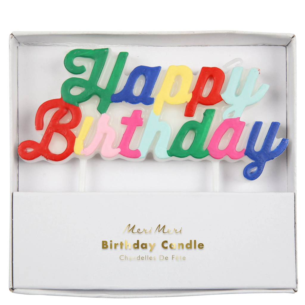 Colorful "Happy Birthday" candles in a decorative box, featuring playful lettering in red, green, blue, yellow, pink, and light blue.