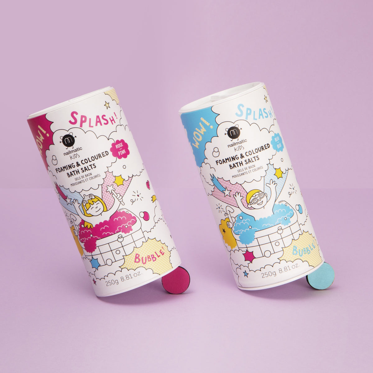 Two playful bath salt containers on a pink surface, featuring colorful illustrations of children and bubbles, conveying fun and excitement.