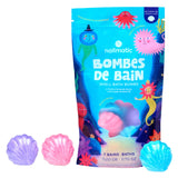 Colorful bag of shell-shaped bath bombs with vibrant ocean-themed illustrations and three bath bombs below in purple, pink, and blue. Fun and playful.