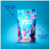 Colorful packaging for nailmatic "Bombes de Bain," featuring cute sea creatures on a blue background. Emphasizes joy and relaxation.