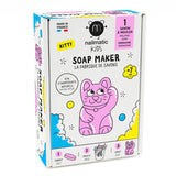 Box of Nailmatic Kids Soap Maker Kit with a playful pink kitten illustration. Contains molding soap, labeled for ages 7+, made in France. Bright, fun design.