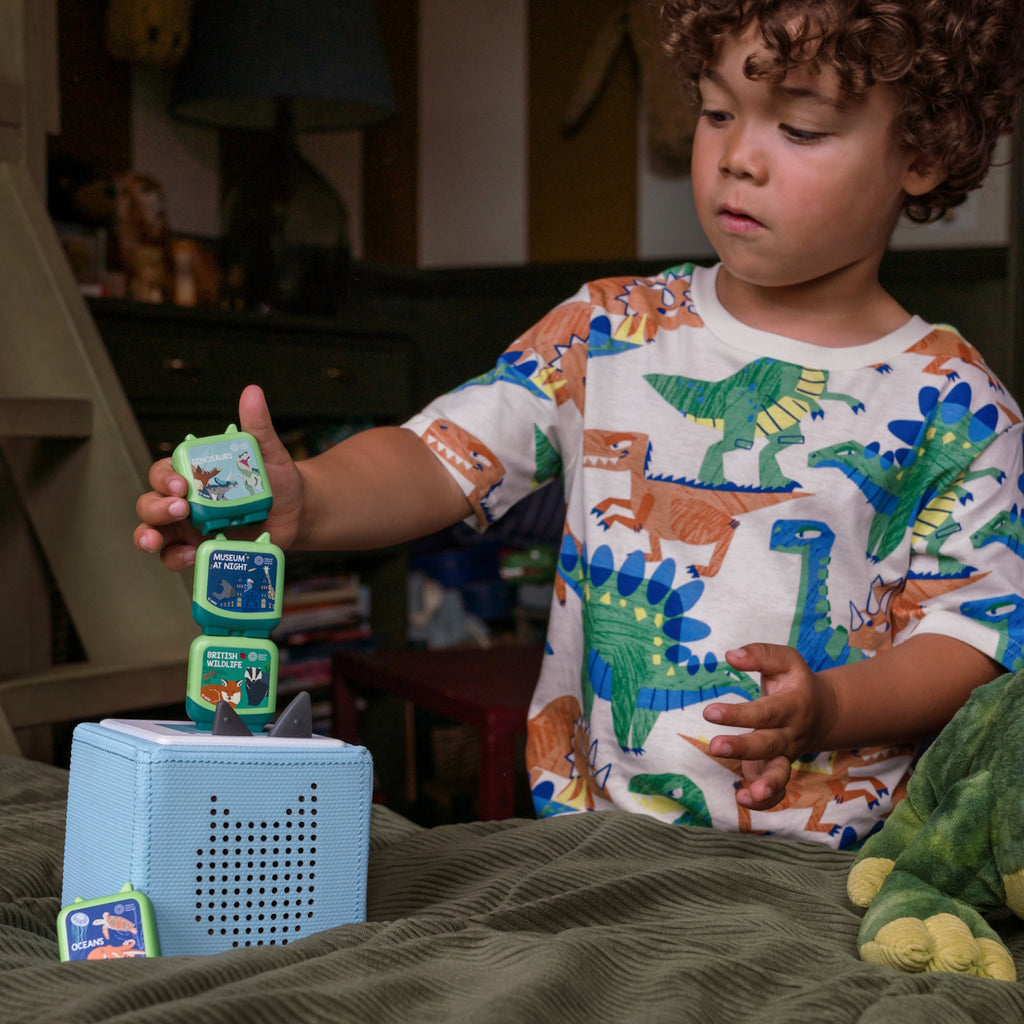 Four colorful educational boxes from the Natural History Museum feature topics: Dinosaurs, Oceans, British Wildlife, and Museum at Night.