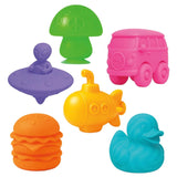 Colorful NeeDoh squishy fidget toys including a purple alien UFO, pink bus, yellow submarine, and orange burger.