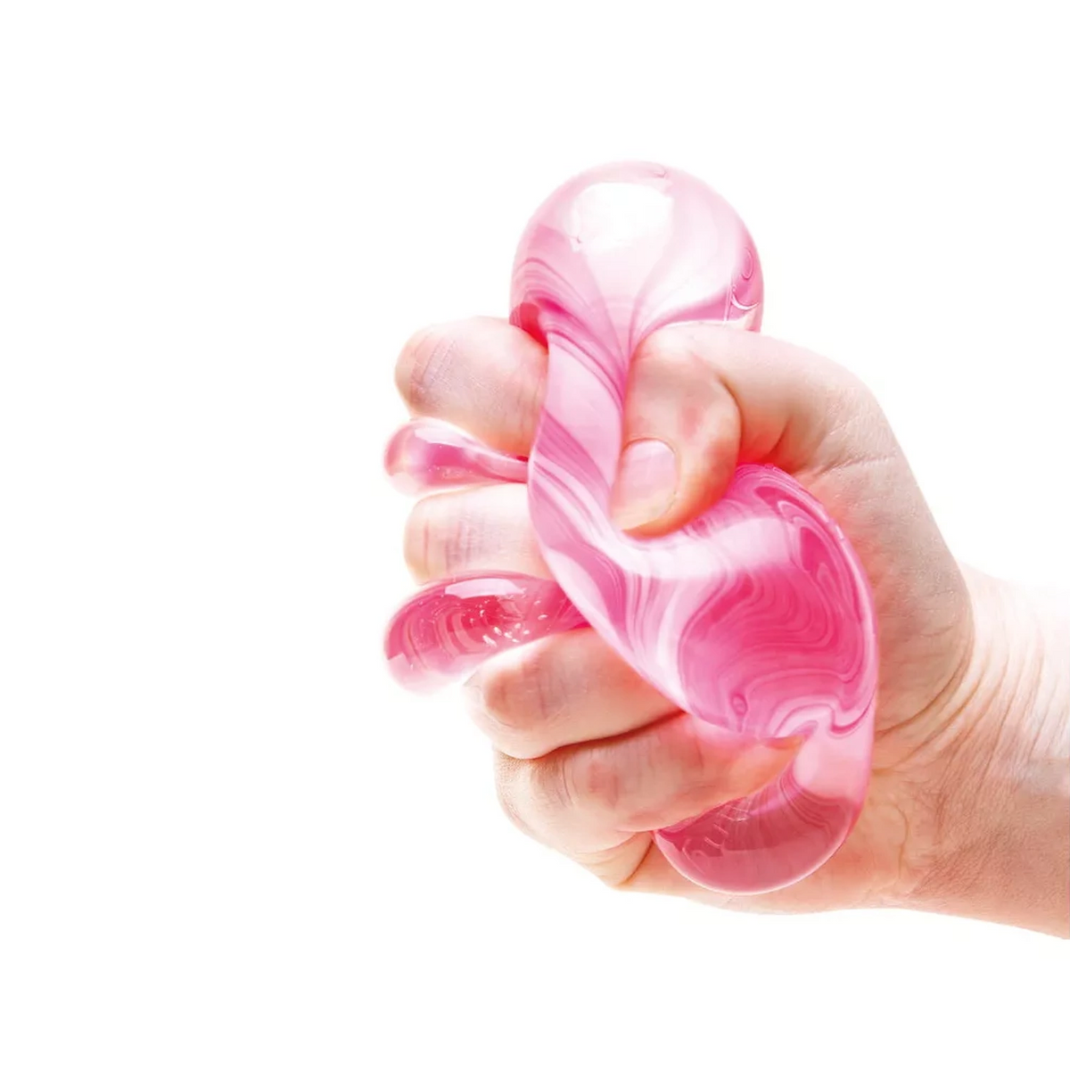 Hand squeezing a pink and white candy swirl NeeDoh Nice Cube sensory fidget toy against a white background.