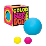 Colorful Nee Doh stress ball set with blue, yellow, and pink balls. The vibrant box showcases retro lettering and captures a playful, fun vibe.