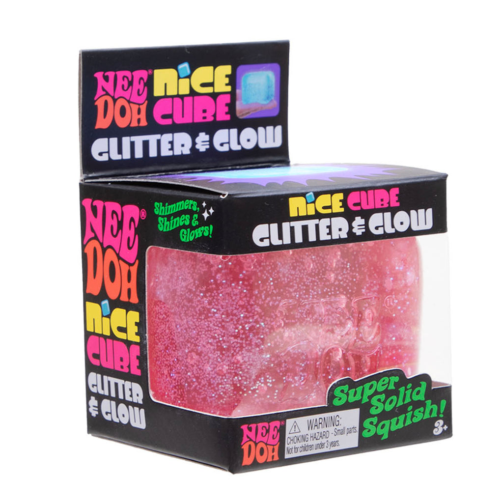 Packaging of a "Nee Doh Nice Cube" toy is shown. The box displays the toy's name in vibrant, colorful text. The red, glittery cube inside shimmers, suggesting a playful and fun product. A label warns it's not for children under three.