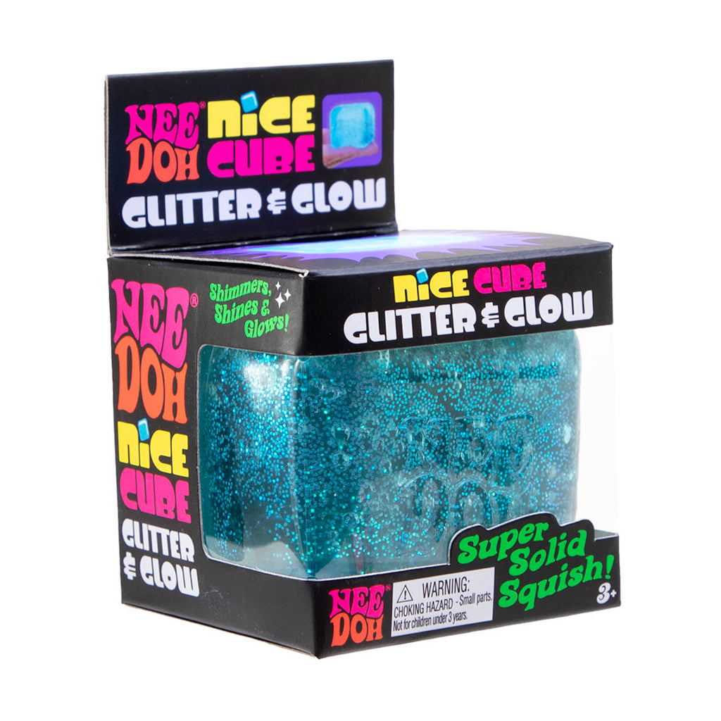 Packaging of a Nee Doh Nice Cube glitter toy. The box is black with colorful text. The toy inside is a sparkly, blue, squishy cube.
