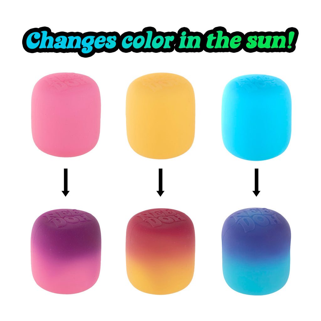 Colorful putty that changes color in the sun. Top row: pink, yellow, blue. Bottom row: purple-pink, red-yellow, blue-purple, with arrows indicating transition. Text reads, "Changes color in the sun!"