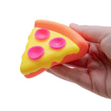 Hand holding a Schylling NeeDoh Squeeza Pizza fidget toy with yellow cheese, pink pepperoni, and an orange crust.