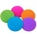Five vibrant Nee Doh stress balls are shown: pink, orange, green, blue, and purple. They overlap slightly, conveying a playful and colorful tone.
