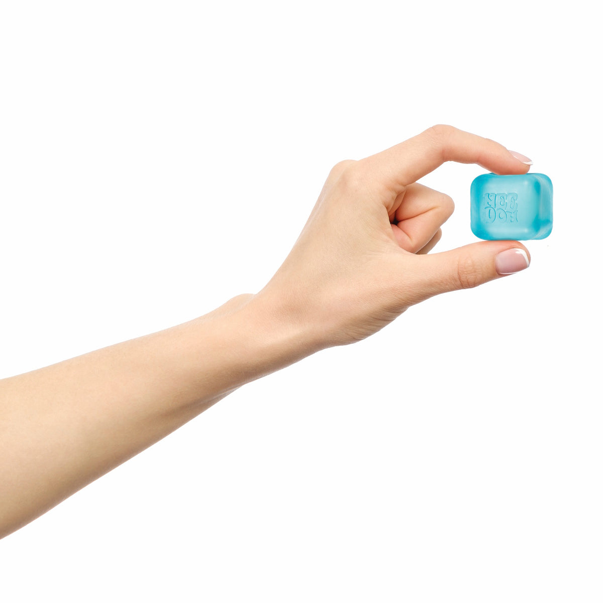 A hand with light skin holds a small blue ice cube between the thumb and index finger against a white background, conveying a sense of freshness.