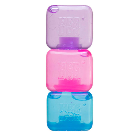Three small, squishy NeeDoh cubes in purple, pink, and blue stacked vertically on a white background.