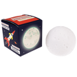 Spherical white moon-shaped night light resting next to its dark blue space-themed packaging box.