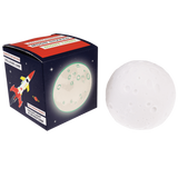 Spherical white moon-shaped night light resting next to its dark blue space-themed packaging box.