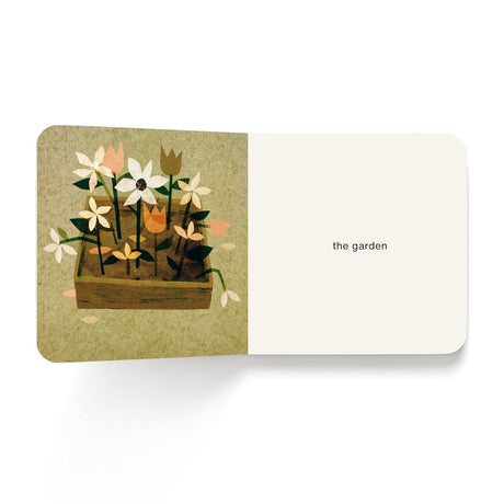 Book spread featuring paper-cut style flowers in a planter box alongside the text 'the garden'.