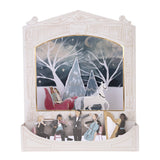 Paper theater with orchestra, displaying a sleigh pulled by a horse through snowy trees.