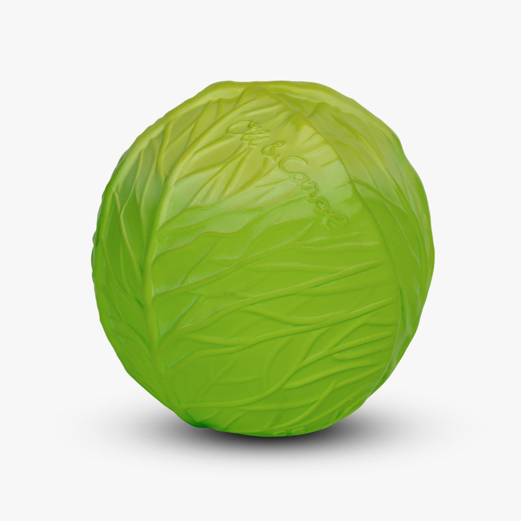 A ball shaped like a vibrant green cabbage with detailed leaf textures, against a plain white background. The playful design evokes a fresh, lively feel.