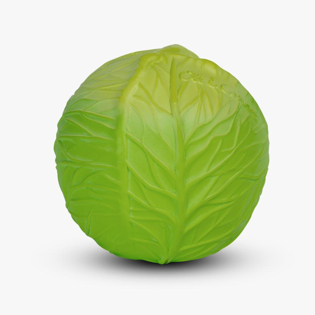 A ball shaped like a vibrant green cabbage with detailed leaf textures, against a plain white background. The playful design evokes a fresh, lively feel.