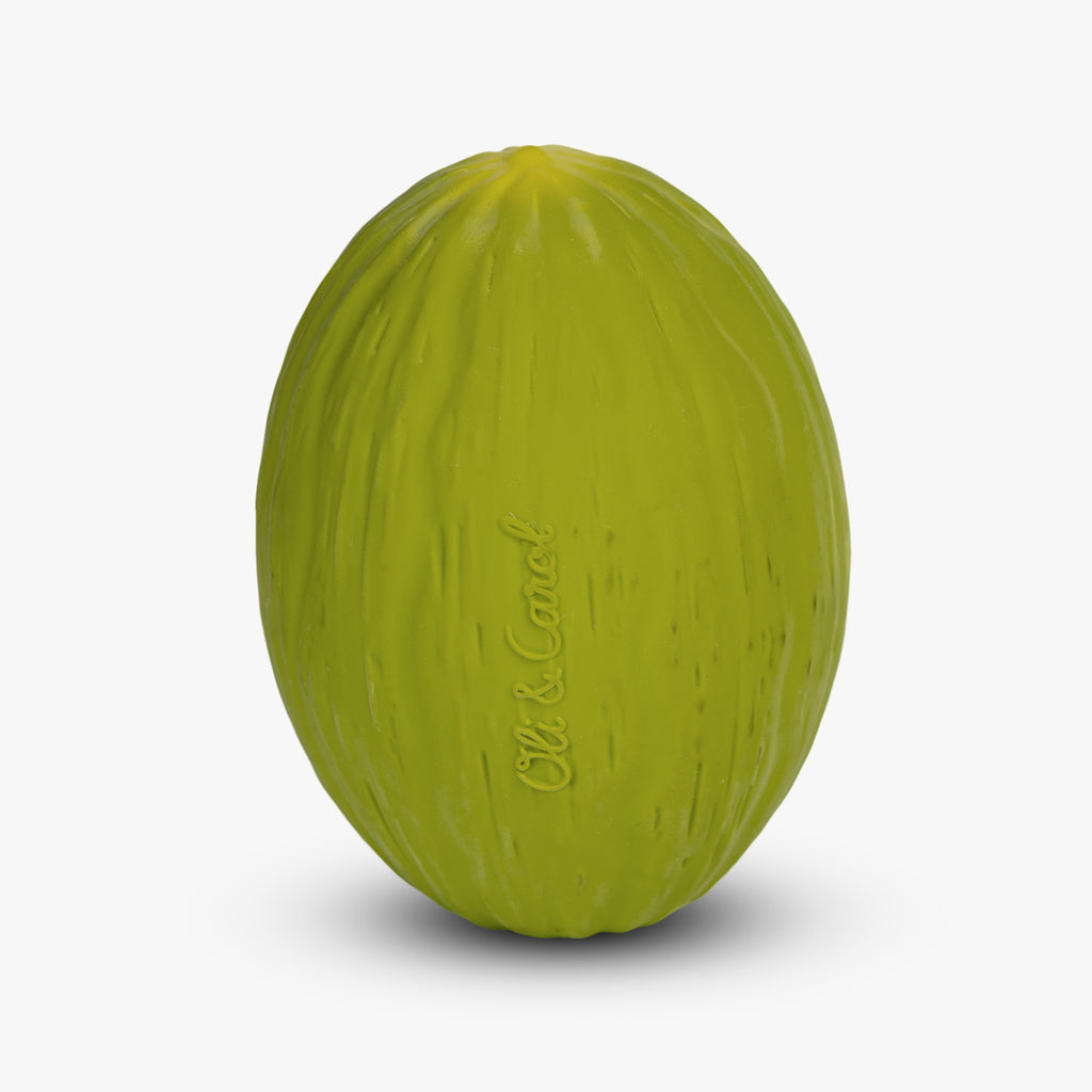 A realistic, bright green watermelon-shaped toy against a plain white background. Textured surface mimics a melon, and "Oli & Carol" is subtly embossed.
