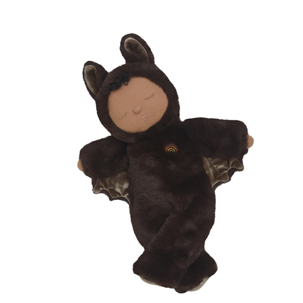Plush doll in a cozy bat costume with closed eyes, smiling. The dark brown suit has bat wings and ears, conveying a calm, playful tone.
