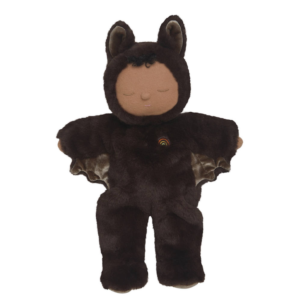 Plush doll in a cozy bat costume with closed eyes, smiling. The dark brown suit has bat wings and ears, conveying a calm, playful tone.