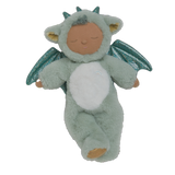 Plush baby doll in a green dragon onesie with sparkly wings and horns. The doll's eyes are closed, and it conveys a peaceful, sleepy expression.