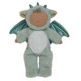 Plush baby doll in a green dragon onesie with sparkly wings and horns. The doll's eyes are closed, and it conveys a peaceful, sleepy expression.