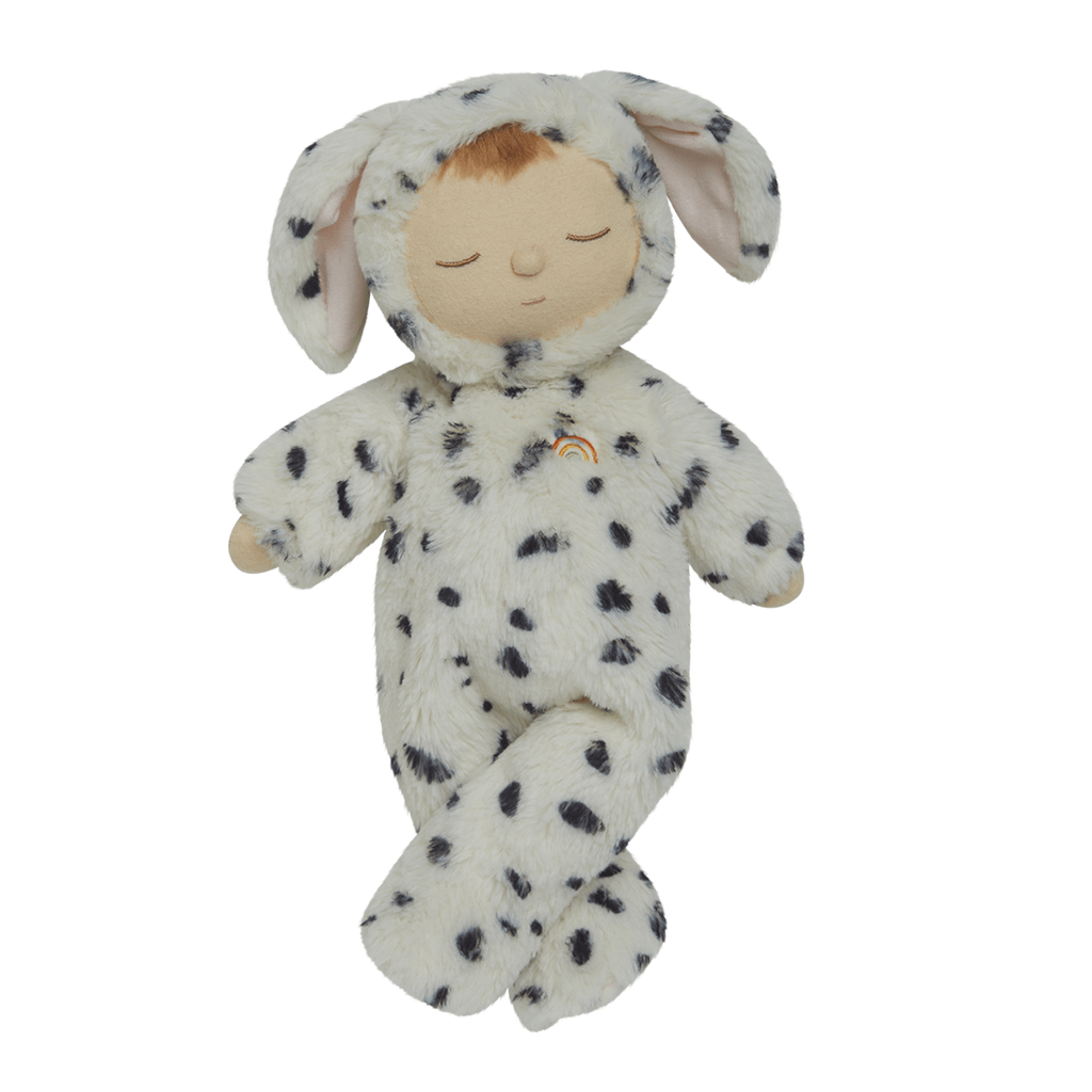Cute plush doll wearing a soft, white Dalmatian costume with black spots and floppy ears. The doll has closed eyes.
