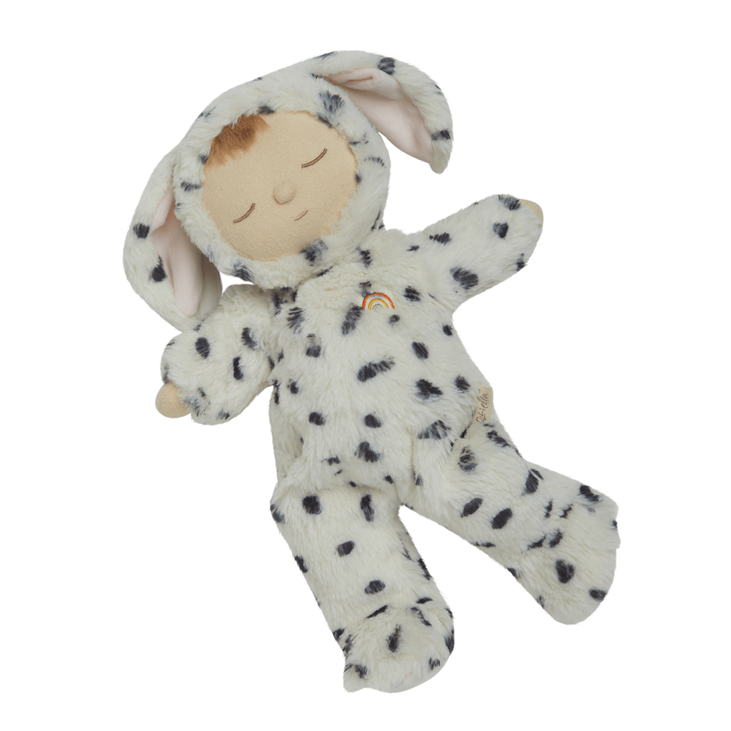 Cute plush doll wearing a soft, white Dalmatian costume with black spots and floppy ears. The doll has closed eyes.