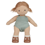 A plush doll with light brown hair wears a knitted light teal romper and brown shoes with white socks. The expression is neutral, set against a white background.