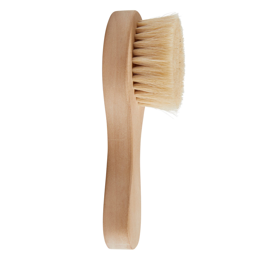 Wooden doll brush with soft, dense bristles, designed for dry brushing. The brush handle is smooth, giving a natural and rustic appearance.