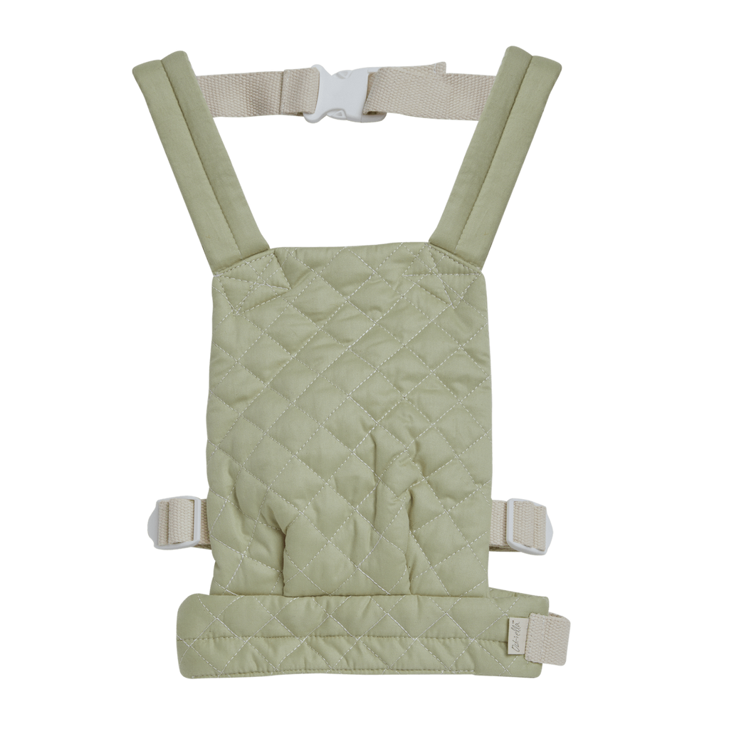 Quilted sage doll carrier with adjustable straps and buckle, displayed against a white background. The carrier has a soft, padded look.