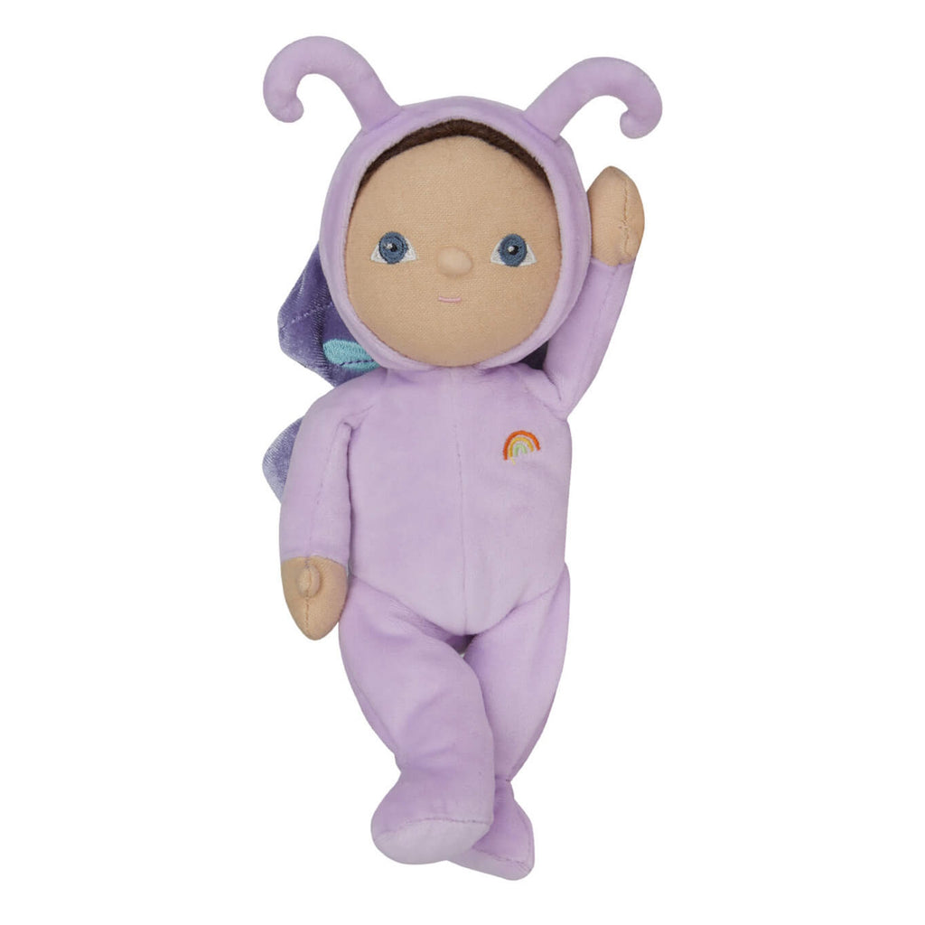 A soft doll in a purple butterfly costume with antennae and wings, featuring a small rainbow emblem. The doll has a gentle, welcoming expression.
