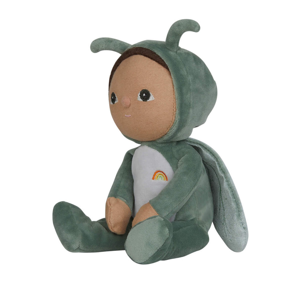 Cute plush doll in a green insect costume with wings and antennae, featuring a small rainbow on its belly. The doll has a gentle, cheerful expression.