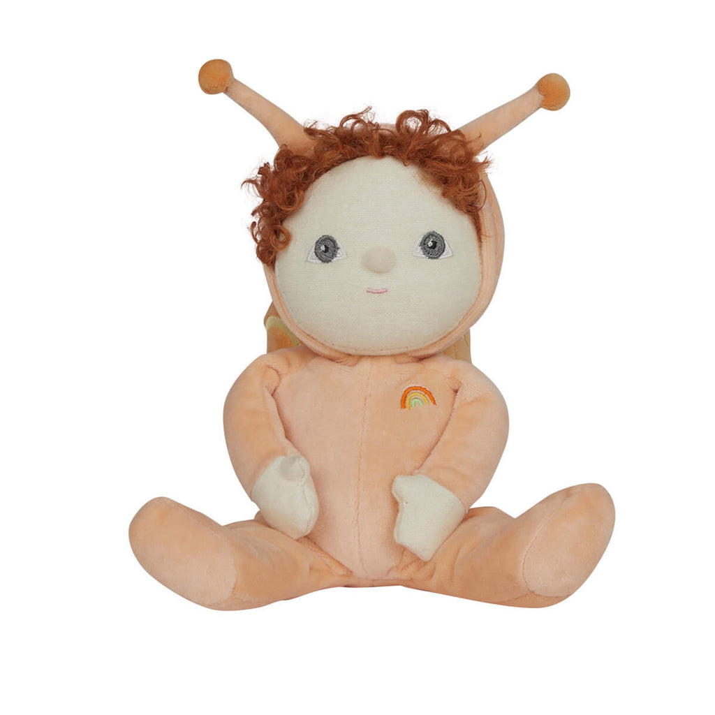 Cute plush doll with curly red hair, dressed in a peach snail outfit with antennas and a rainbow emblem. It sits with a sweet, cheerful expression.