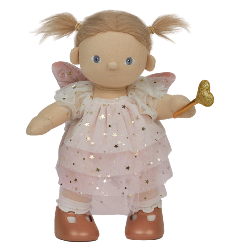 A doll with pigtails wears a pink star-patterned fairy dress, wings, and holds a gold heart wand. The doll has a cheerful expression.