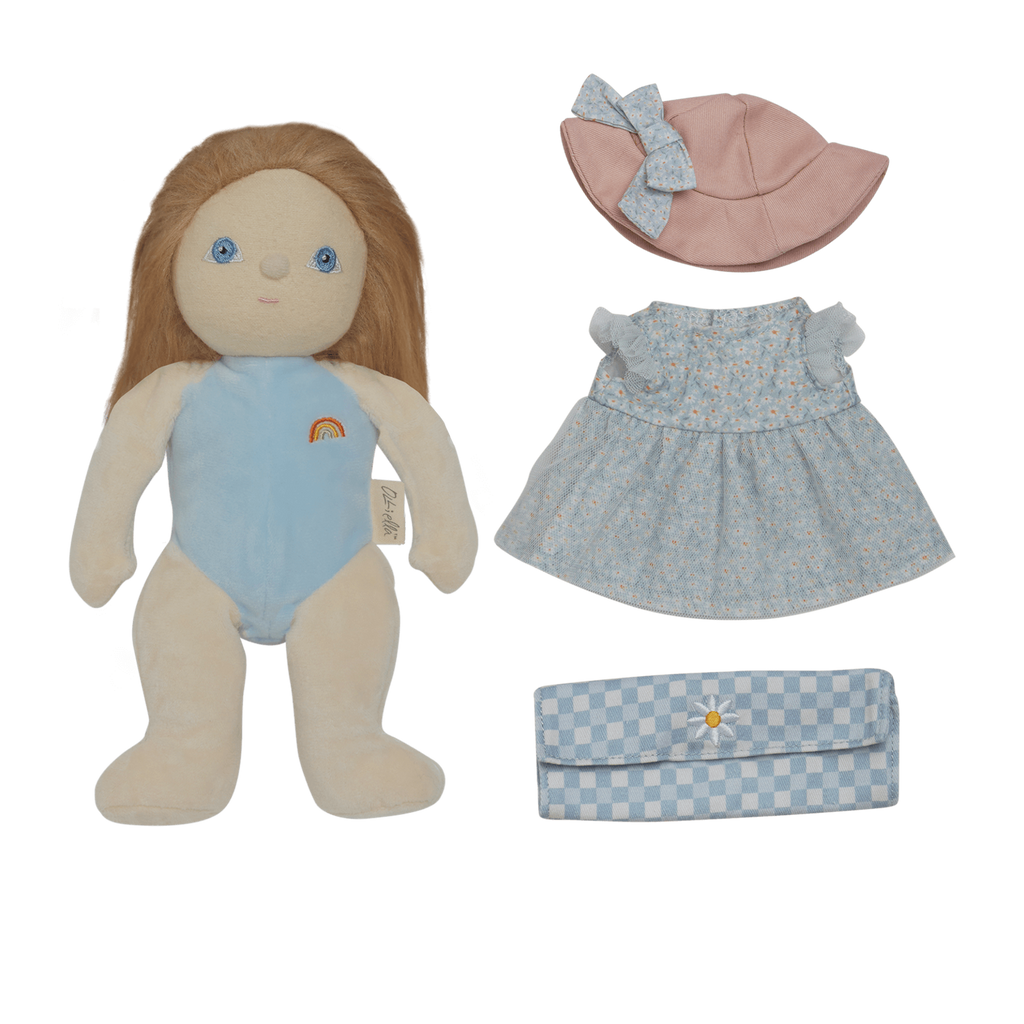 A plush doll with long hair and a light blue outfit featuring a rainbow. Accompanied by a pink hat, a floral dress, and a blue checkered clutch.
