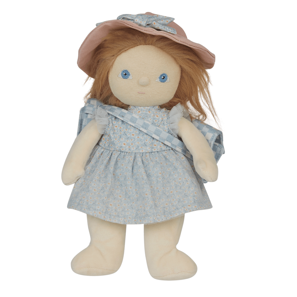A soft doll with long brown hair wearing a pastel blue dress and a wide-brimmed pink hat. The doll has simple, embroidered blue eyes.