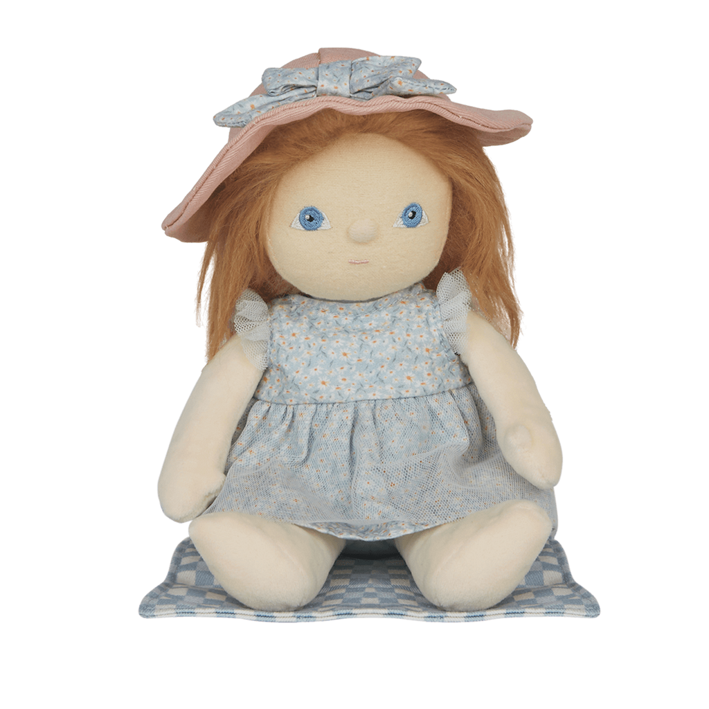 A soft doll with long brown hair wearing a pastel blue dress and a wide-brimmed pink hat. The doll has simple, embroidered blue eyes.