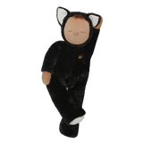 Plush doll dressed as a cat with black fur, white paws and ears, and a tiny rainbow on its chest. The doll's eyes are closed, creating a peaceful expression.