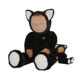 Plush doll dressed as a cat with black fur, white paws and ears, and a tiny rainbow on its chest. The doll's eyes are closed, creating a peaceful expression.
